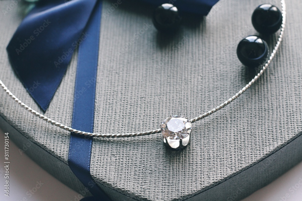 Jewelry composition on interior background with bokeh