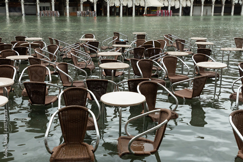 chairs in the flooded San Marco square © lindacaldwell