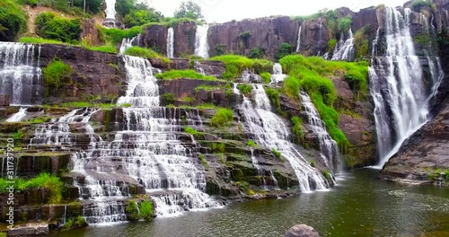 Aerial shooting of beautiful Pongour waterfall in Vietnam, Da lat city.Drone view for amazing vietnamese landscape. photo