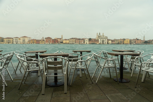 view of Venice from Giudecca with tables and chairs