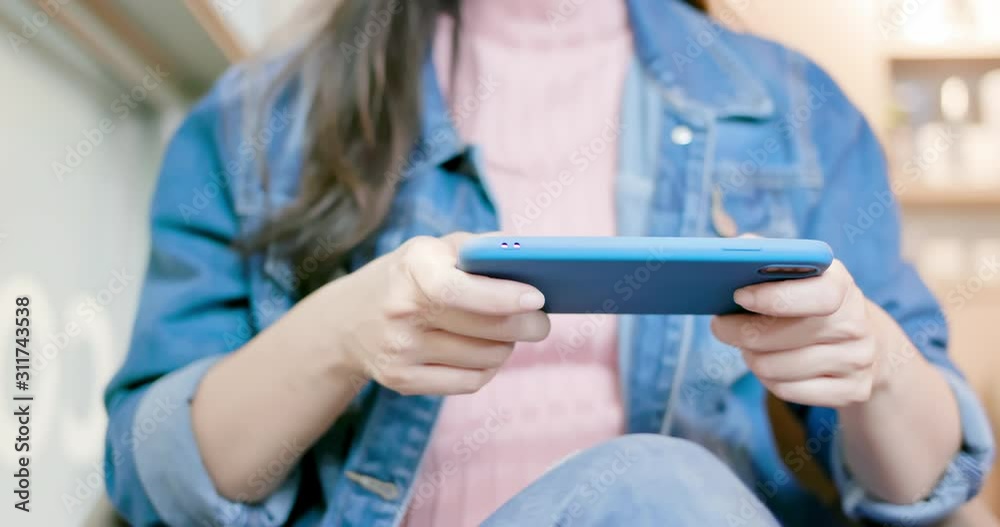 woman play games on smartphone woman play games on smartphone