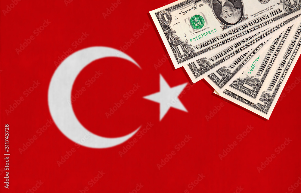 Obraz premium Turkish flag with US dollars in the corner