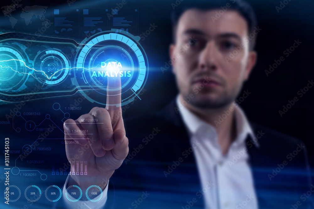 Business, Technology, Internet and network concept. Young businessman working on a virtual screen of the future and sees the inscription: Data analysis Business, Technology, Internet and network concept. Young businessman working on a virtual screen of the future and sees the inscription: Data analysis