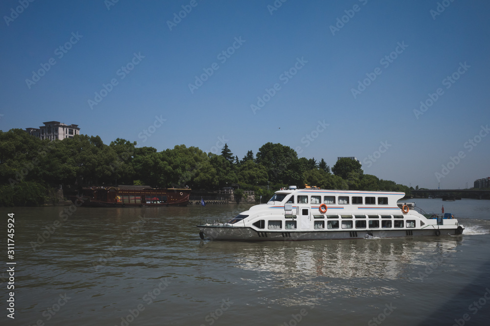 Water bus in Grand Canal in Hangzhou, China Water bus in Grand Canal in Hangzhou, China