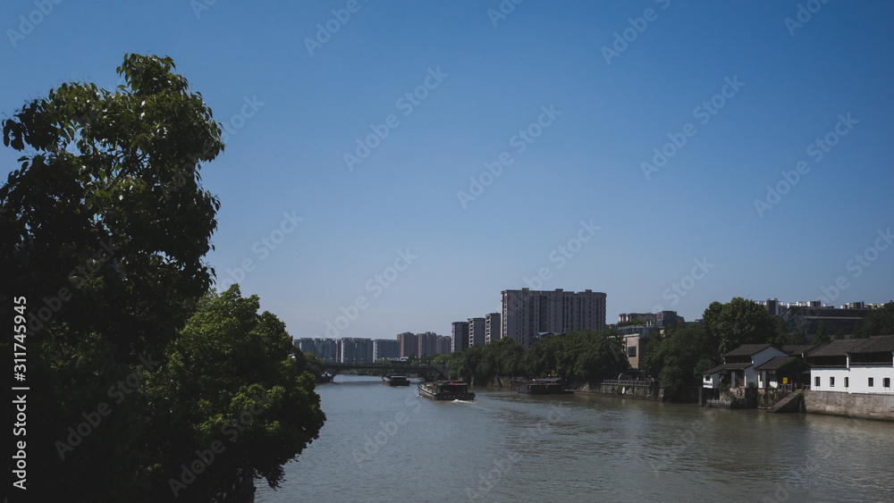 Naklejka premium Cargo ship in Grand Canal in Hangzhou, China