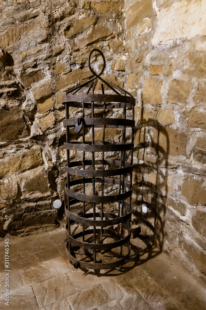 Tools of the Middle Ages for torture. Hanging metal cage Stock Photo |  Adobe Stock