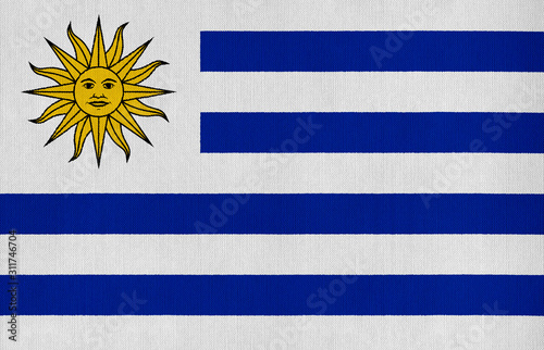 National flag of Uruguay on a cotton texture background