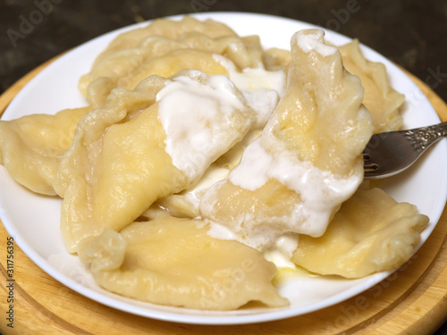 Dumplings with cottage cheese and sour cream.