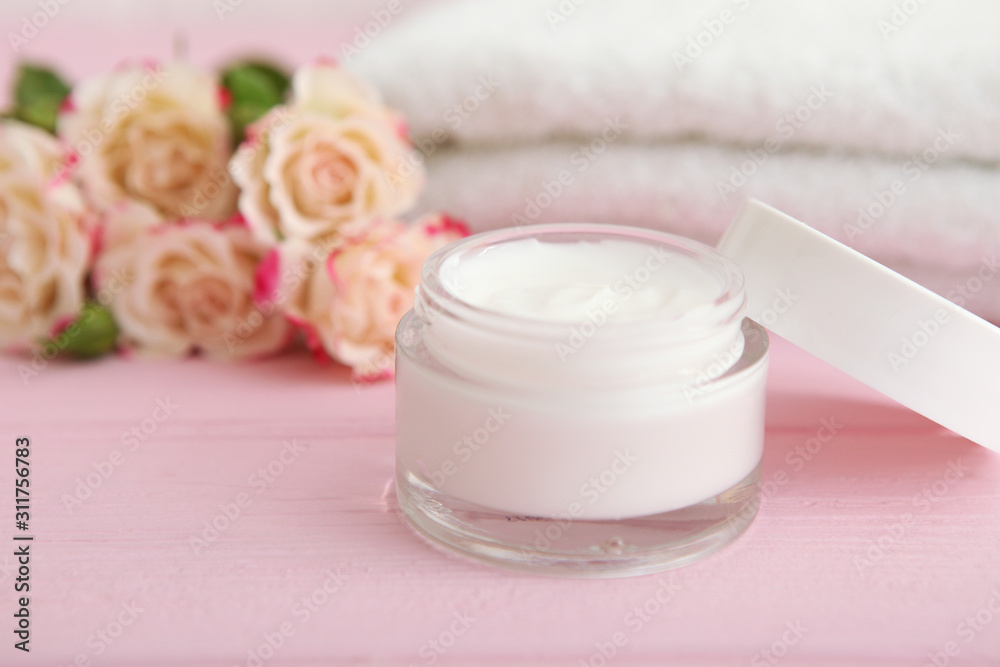 skincare cream and flowers on the table. Cosmetics for skin care. skincare cream and flowers on the table. Cosmetics for skin care.