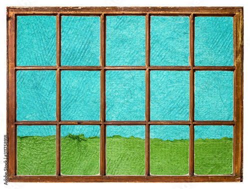 green field and blue sky - window view