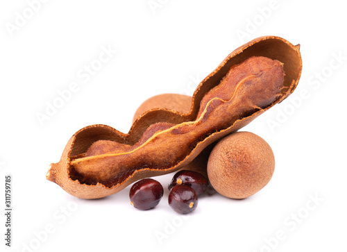 Sweet tamarind isolated on white background. Fresh tamarind fruit and seeds.