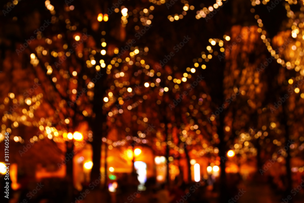 abstract background of colorful blurred defocused bokeh street lights. motion and nightlife concept.
