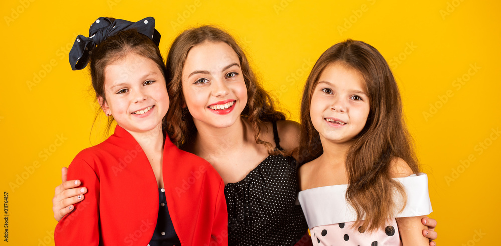 Beautiful us. Happy small girls. Classy cute girls. Little girls with beauty look. Fashion girls. Prom or party. Holiday celebration. Fashion and style. Beauty salon