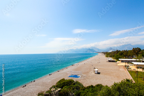 Tourist beach of the Mediterranean Sea. Antalya, Turkey, April 6, 2019.