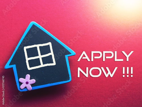 APPLY NOW written on red background with wooden house
