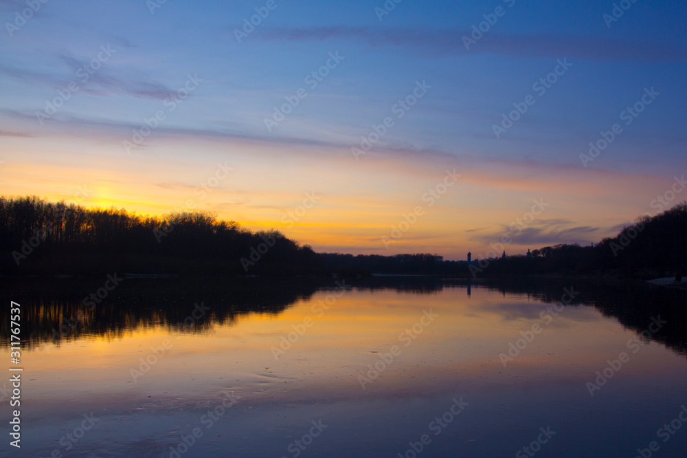 Plain river in the fall after sunset.