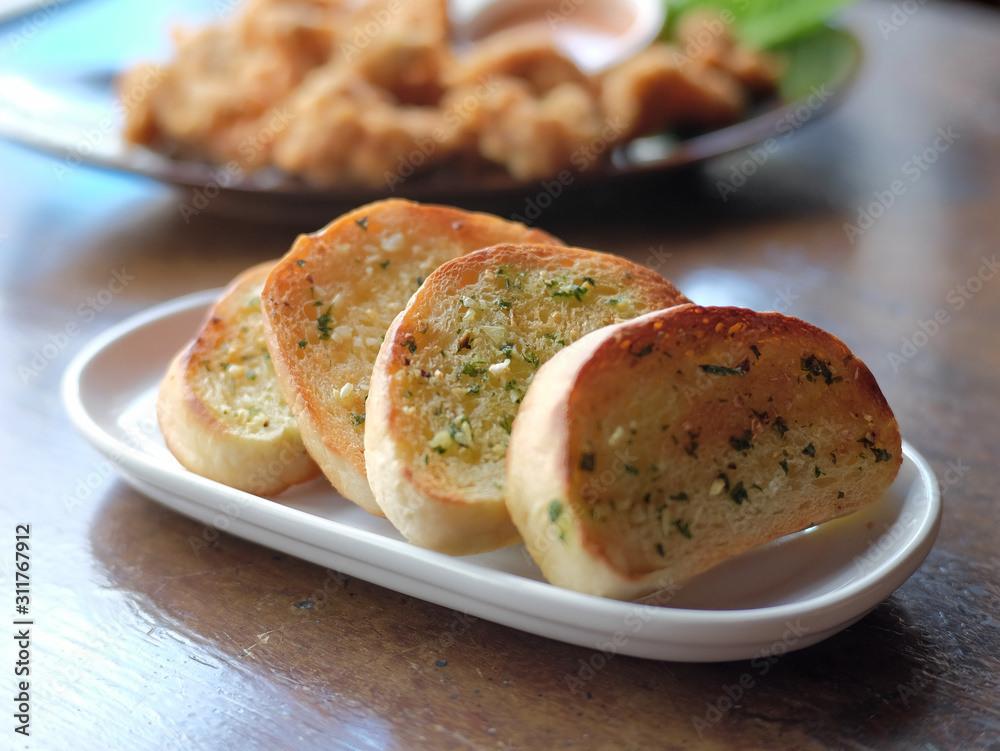 garlic bread in white plate