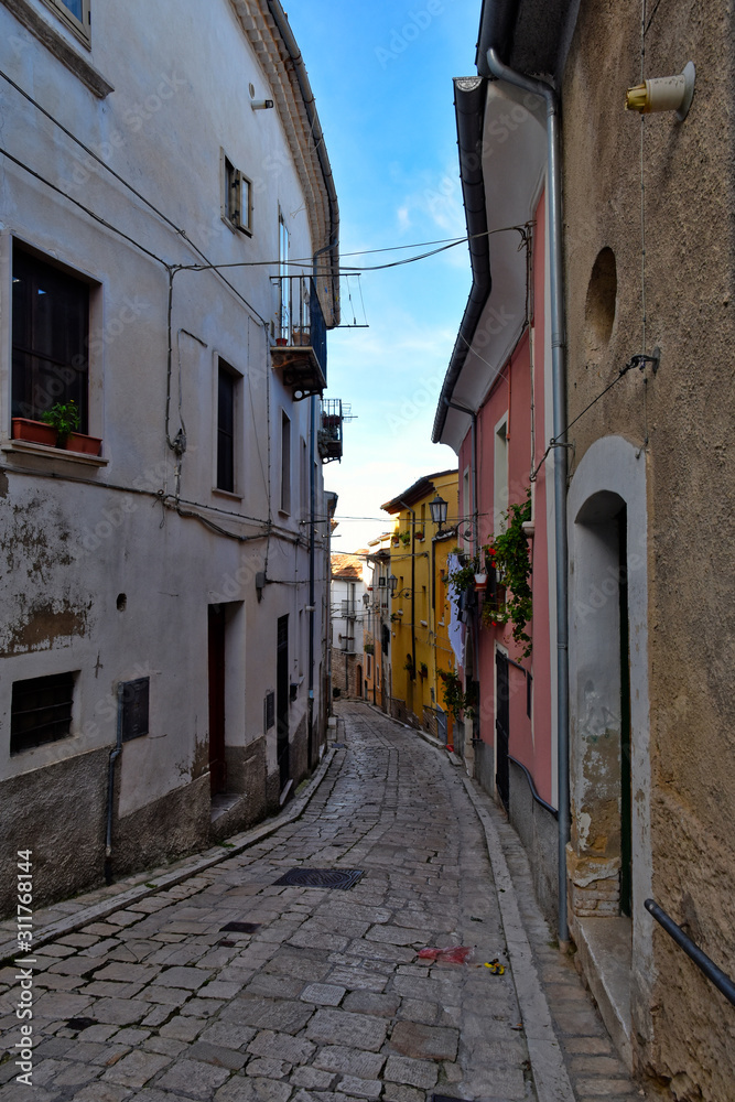 Campobasso, Italy, 12/24/2019. A narrow street between the alleys and buildings of a medieval city