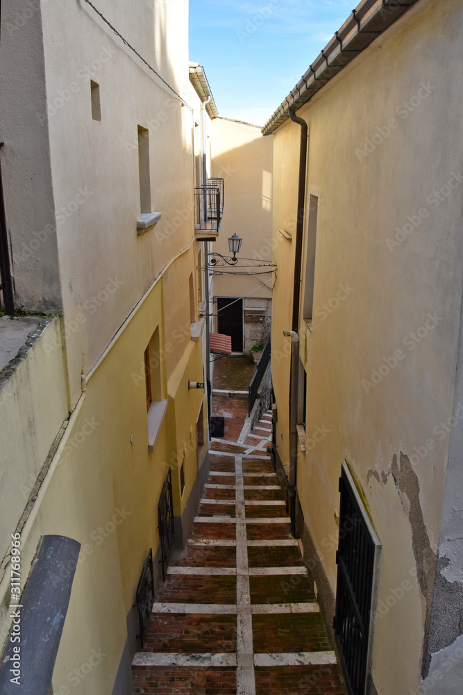 Campobasso, Italy, 12/24/2019. A narrow street between the alleys and buildings of a medieval city