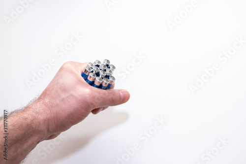 Batteries in the hands of a man on a white background, isolated.