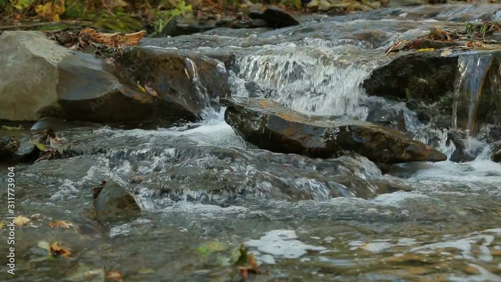 The rapid course of the mountain river and rapids The rapid course of the mountain river and rapids
