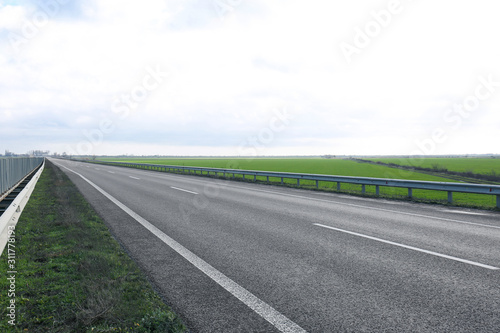Beautiful view of asphalt highway without transport
