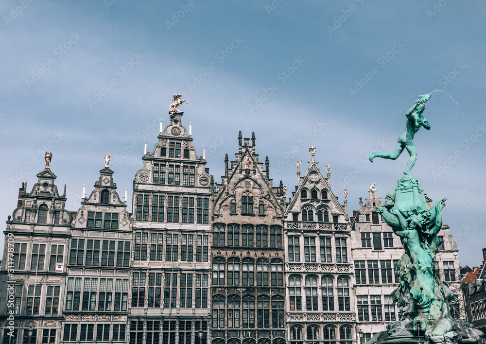 A row of Famous Antwerp historic building, and  Brabo fountain sculpture.
