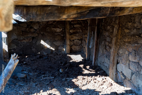 Stone remains of cellar in old abandoned balkar village in North Caucasus