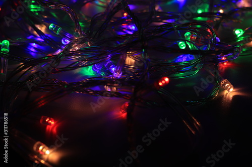 Abstract background of Christmas lights in the dark