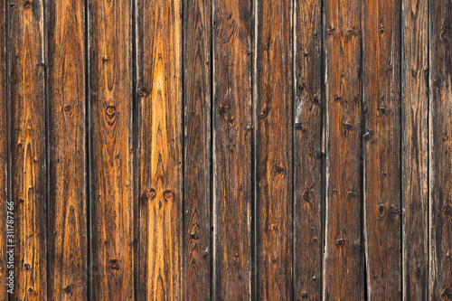 fragment of the gate from old wooden planks in natural color
