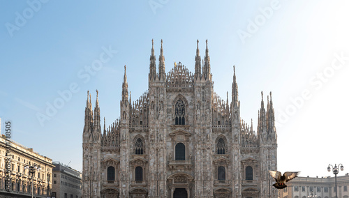 Milan, Italy. View of the Milan Cathedral with a flying bird photo