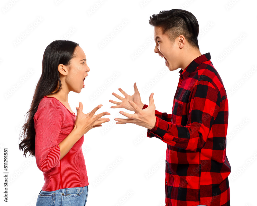 Quarrelling Asian couple on white background Quarrelling Asian couple on white background