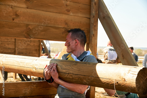 Moving wooden logs at competitions. photo