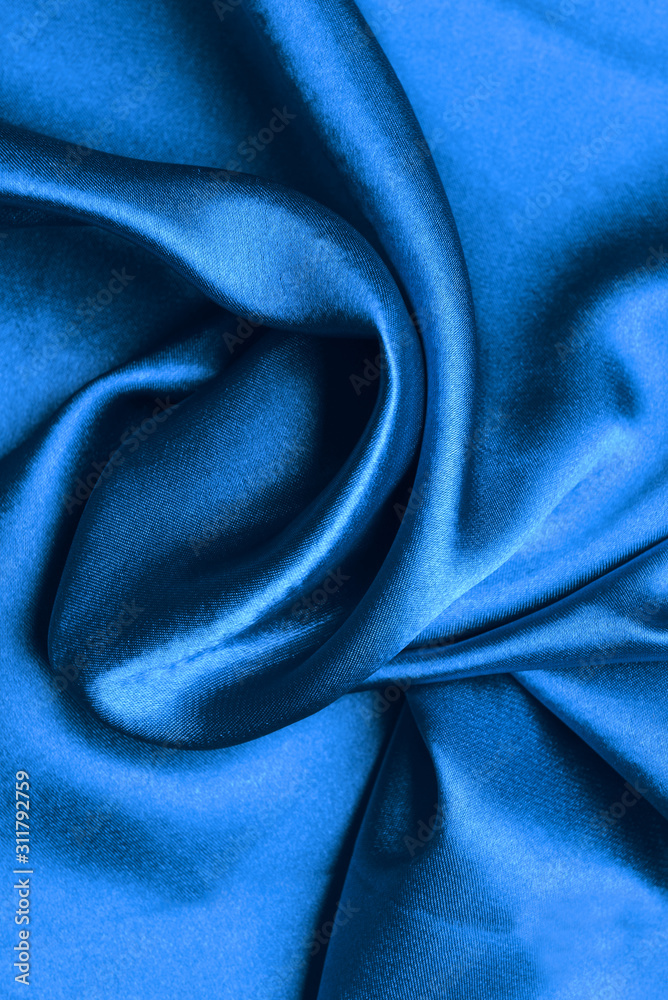 Fototapeta premium Texture of blue fabric, closeup