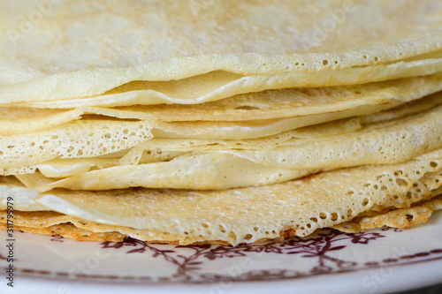 Delicate edges of thin Russian pancakes