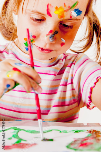 Joyful cute child girl painting. Creativity, child development in art, happy childhood concept