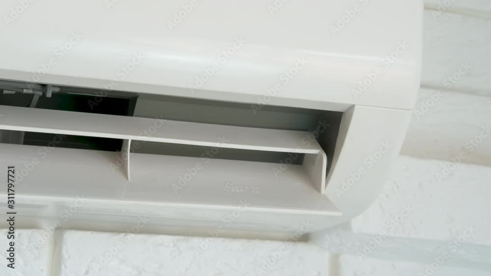 New air conditioner. The household air conditioner rotates with blades. New air conditioner. The household air conditioner rotates with blades.