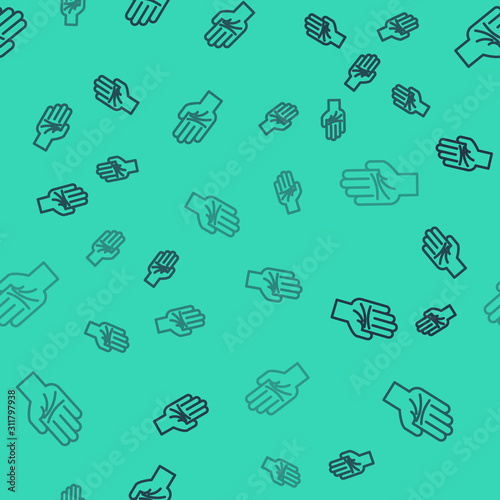 Black line Palmistry of the hand icon isolated seamless pattern on green background. Vector Illustration