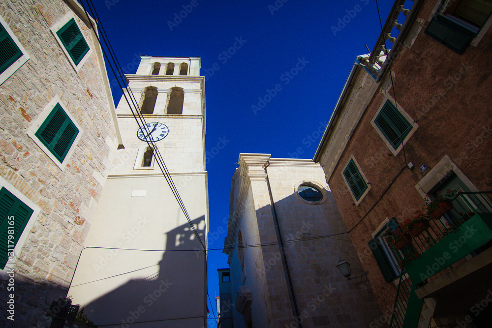 Vodice, Croatia / 17th May 2019: Church and Bell tower in old city centre