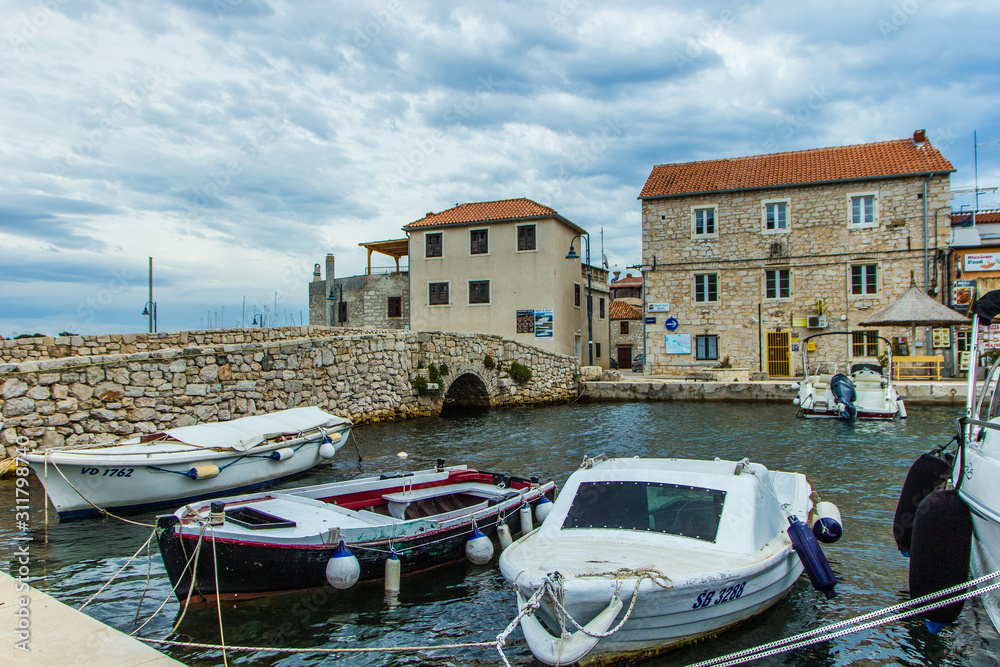 Tribunj, Croatia / 18th May 2019: Seafront view on fisherman village Tribunj in Croatia, postcard
