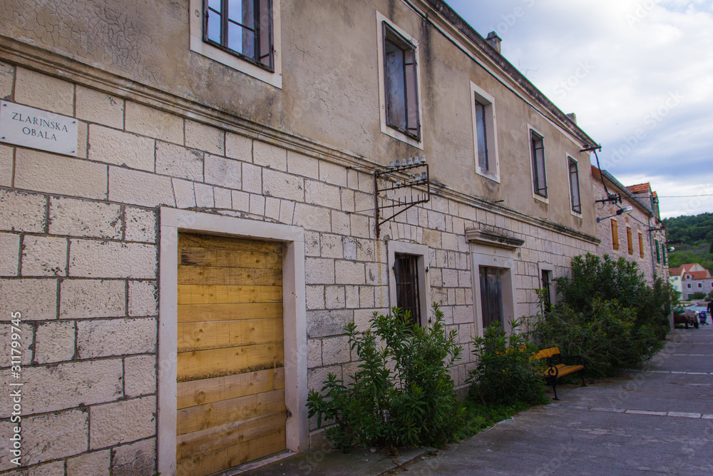 Zlarin, Croatia / 18th May 2019: Old stone streets and houses in Zlarin island near Sibenik