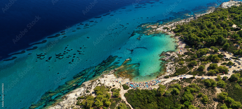 Aerial drone ultra wide photo of beautiful exotic paradise rocky turquoise beach in Caribbean island destination