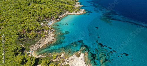 Aerial drone ultra wide photo of beautiful turquoise bay and beach of Kavourotripes with rocky seascape in Sithonia Peninsula, Halkidiki, Greece