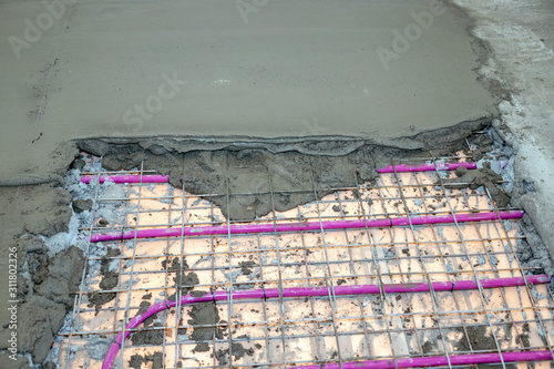 Installation of Underfloor heating, heated with antifreeze. Underfloor heating with heat transfer fluid. Cement screed with metal reinforcement