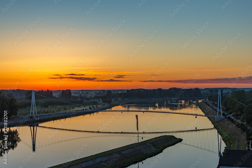 Osijek, Croatia: Beautiful sunrise over river Drava and Pedestrian bridge in Osijek