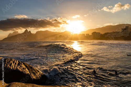 Sunset on the Arpoador rock, Arpoador beach in Rio de Janeiro, Brazil photo
