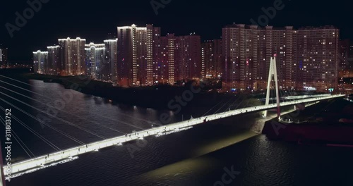 Aerial night Pavshinsky bridge with pedestrians photo