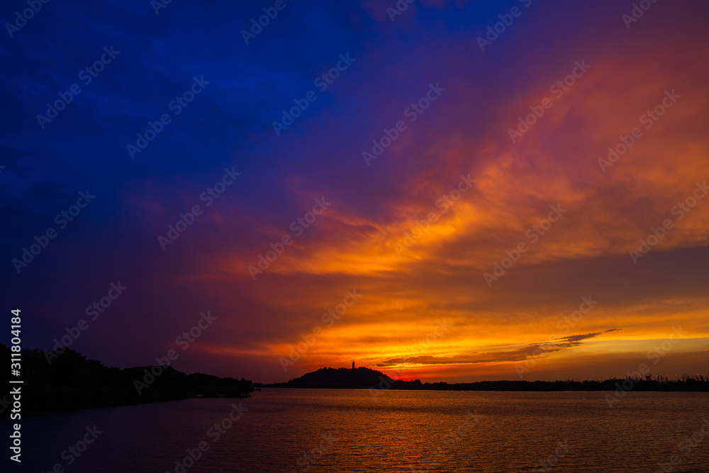 sunset island in the lake with  colorful sky
