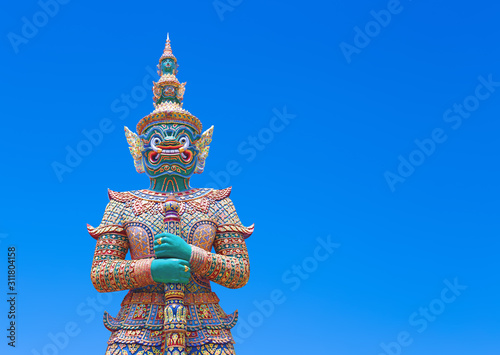 The beautiful Giant statue isolated on blue