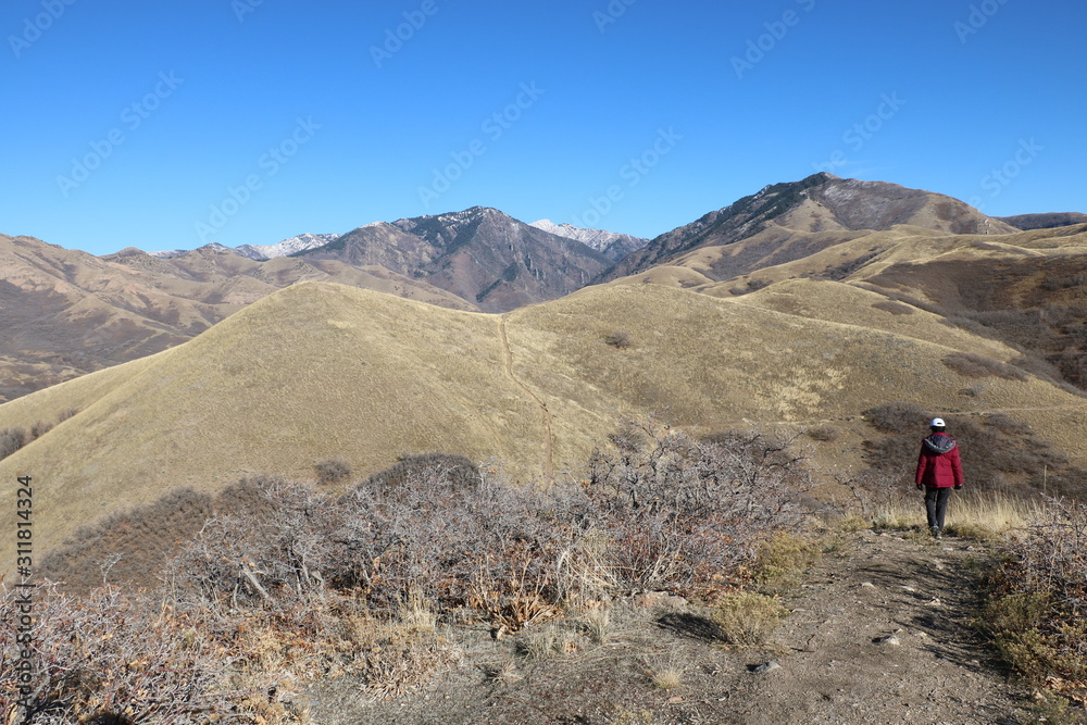 Lone hiker in the dry foothills of the Wasatch range